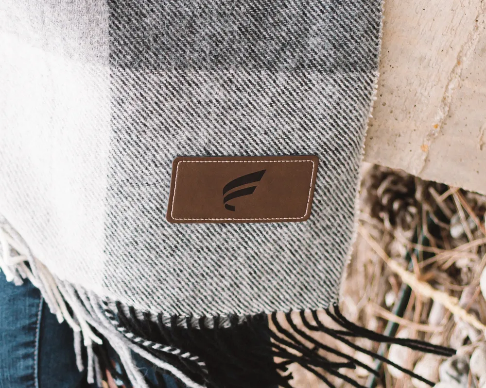 Fluent Conveyors Laser Engraved Brown Leather Patch Blanket by Anthem Branding