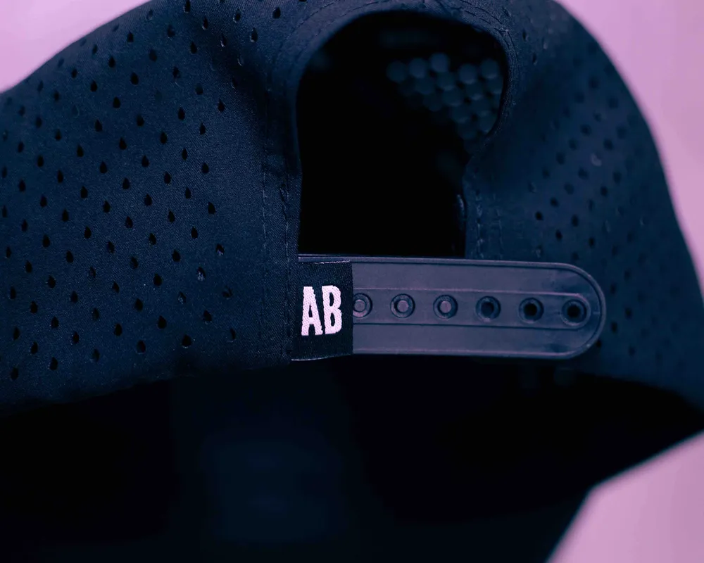 Anthem Branding custom 5 panel performance hat interior taping by anthem branding snapback clamp tag