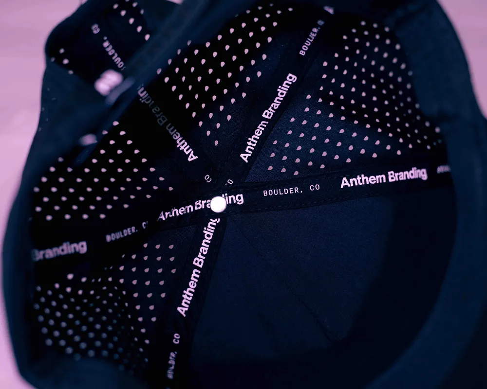 Anthem Branding custom 5 panel performance hat interior taping by anthem branding