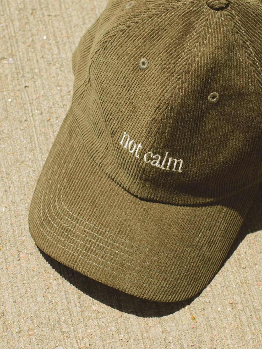 Calm olive green corduroy dad hat by anthem branding 1