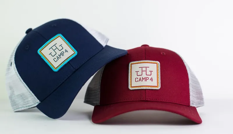Trucker Hats for Camp 4 Wine Cafe Stacked by Anthem Branding