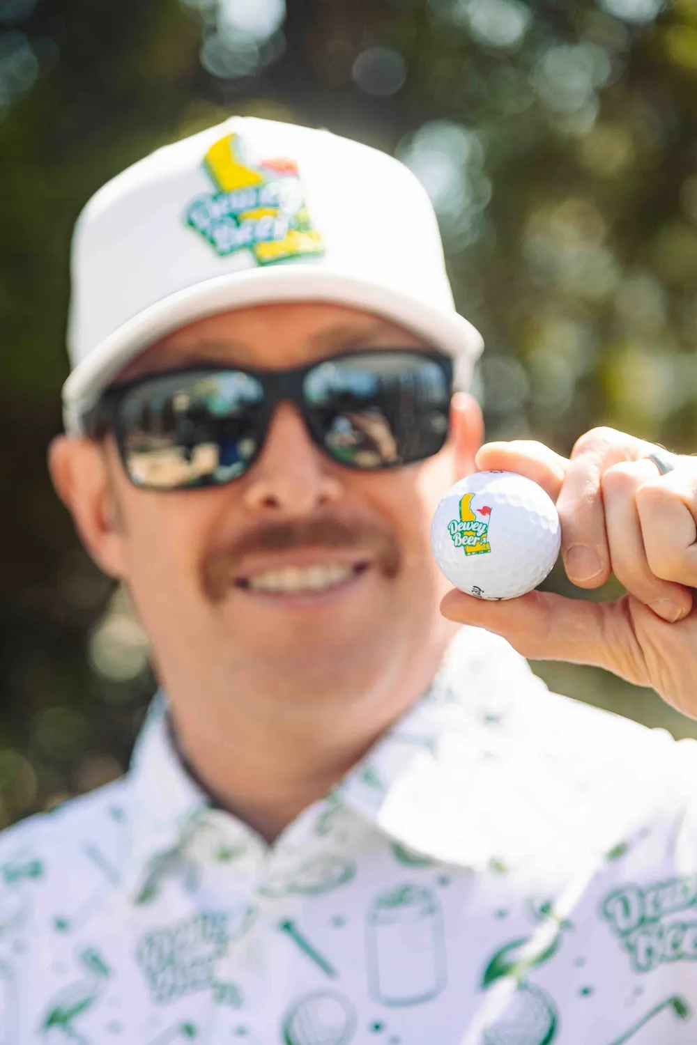 Dewey beer custom golf hat and golf polo by anthem branding