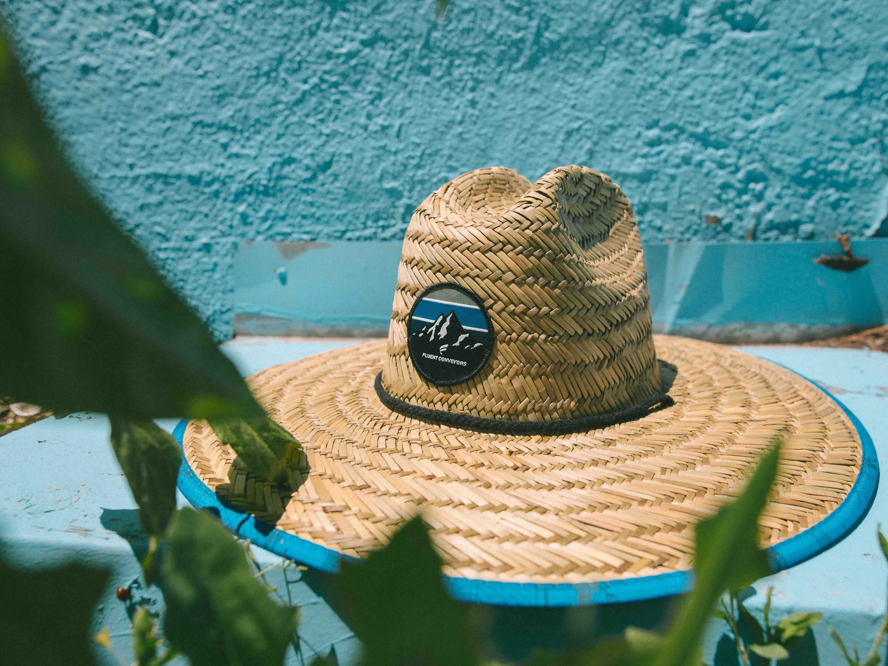 Fluent conveyors custom branded straw hat anthem branding