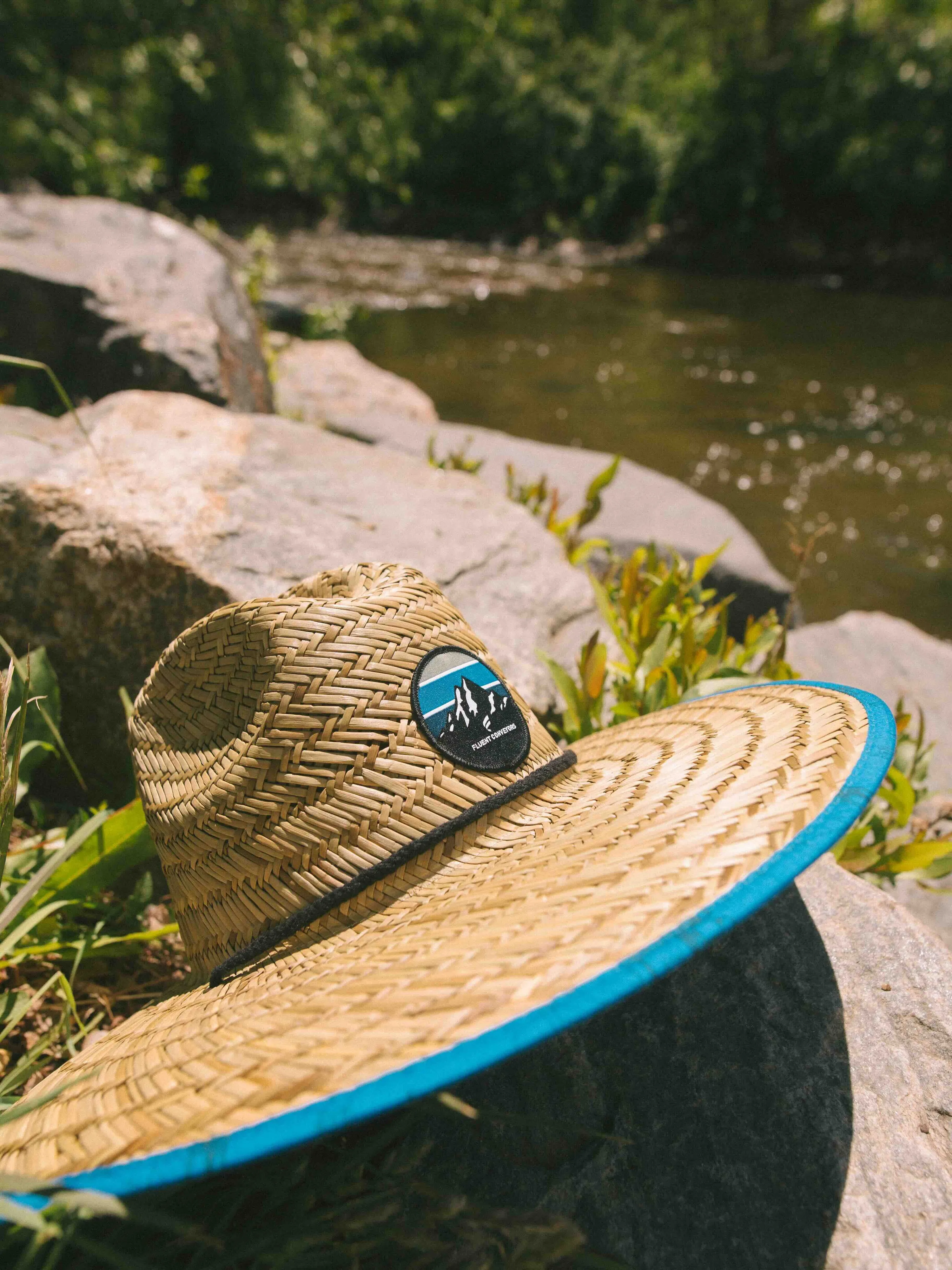 Fluent conveyors custom straw hat anthem branding