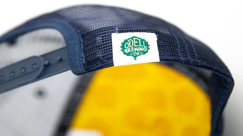 Odell Brewing Company Trucker Hat Woven Label by Anthem Branding