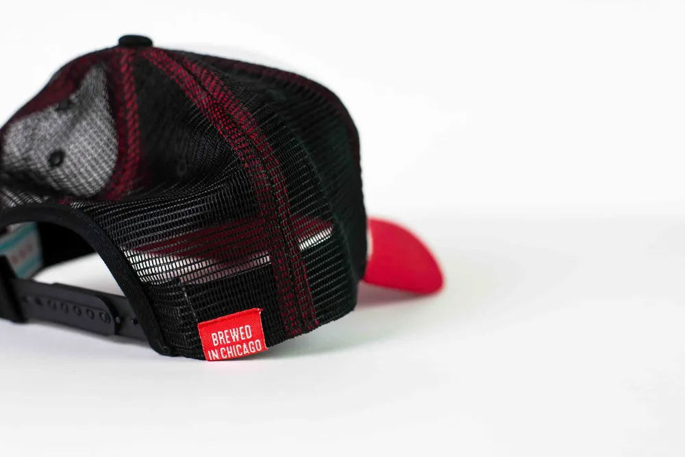 Curved Brim Trucker Hat Left Side Details for Revolution Brewing by Anthem Branding