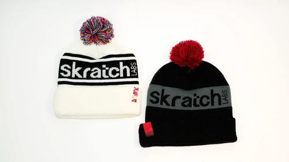 Skratch Labs Custom Multi Colored Pom Beanies White and Black by Anthem Branding
