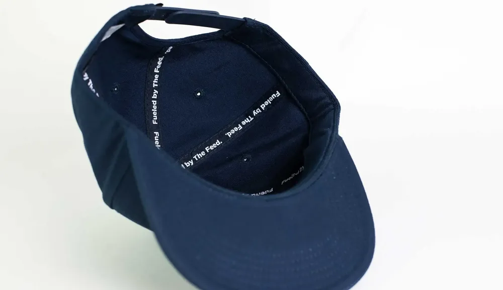 The Feed Camper Hat Navy Interior Seams by Anthem Branding