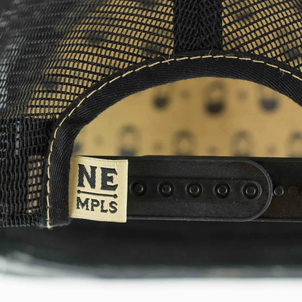 Snapback woven clamp tag detail by anthem branding