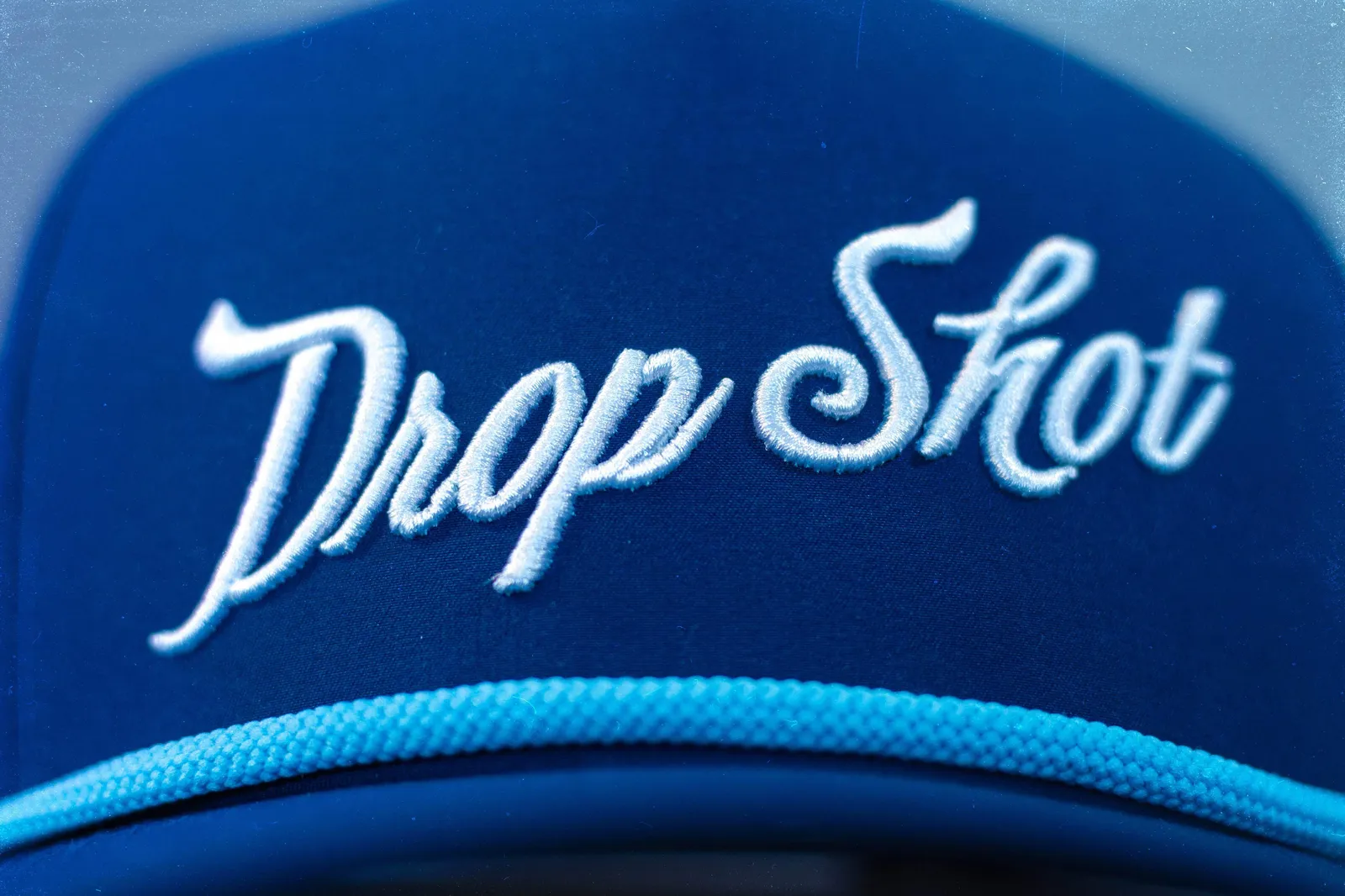 Drop Shot Performance Trucker Hat Navy Blue 3 D Puff Embroidery Brim Rope by Anthem Branding 2