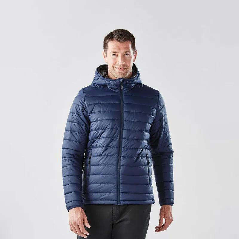 The Stavanger Thermal Jacket offers water-repellent protection, feather-free insulation, and versatile features like a packable pocket and audio ports for maximum functionality.